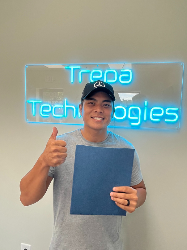 Student with their certificate and exam results